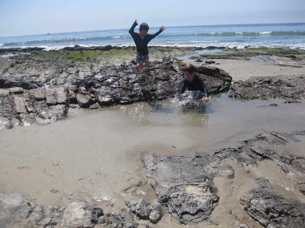 Leaping into tide pools at Crystal Cove.