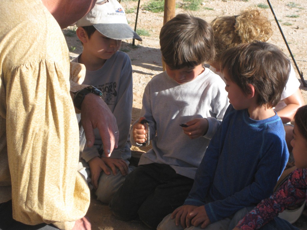 We often just followed Kid's Camp around, because they visited many of the instructors at Winter Count - here each child got a chance to make a spark and catch a piece of char cloth on fire.