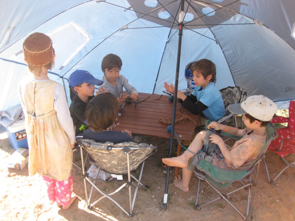 Cole decided to have his own class; he set a class time and location, and taught kids to finger knit on 4 fingers.